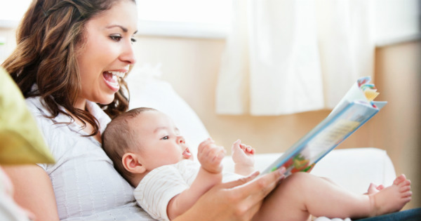 Mum reading to a baby