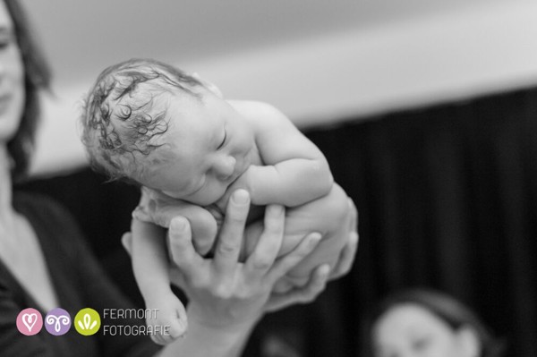 hands holding newborn baby