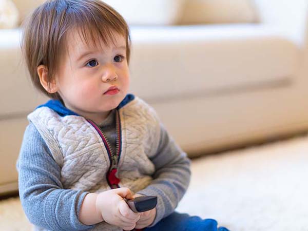 Young asian child with remote control