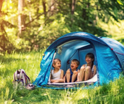 Kids camping in tent in the bush - feature