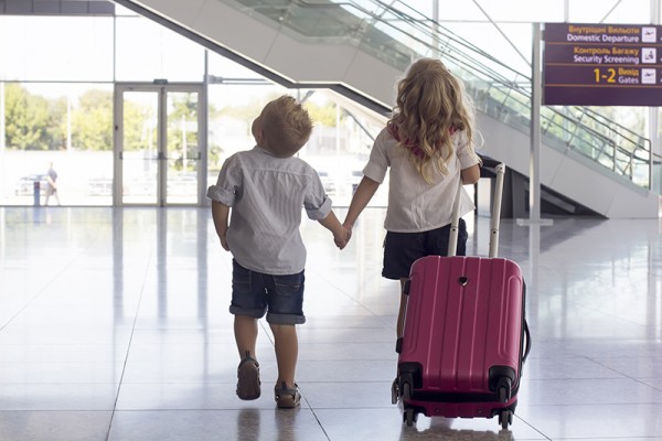 girl n boy at the airport with a suitcase; Shutterstock ID 164637131; PO: 1034194; Job: MPOS1455; Client: Australia Post; License to Y&R Group?: Yes