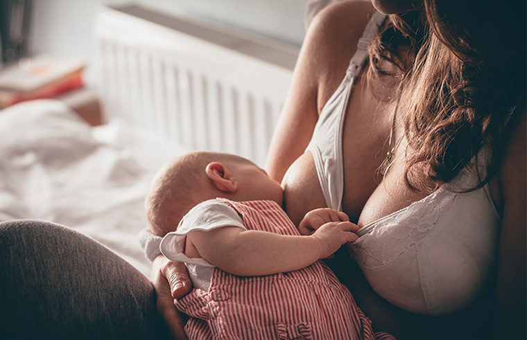 Breastfeeding baby with maternity bra - feature