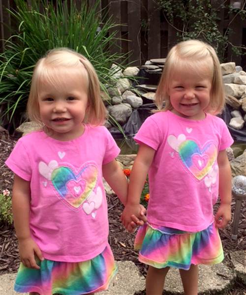Twins born holding hands are as inseparable as ever