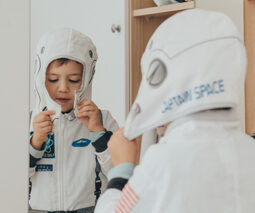 Young boy wearing astronaut costume - feature