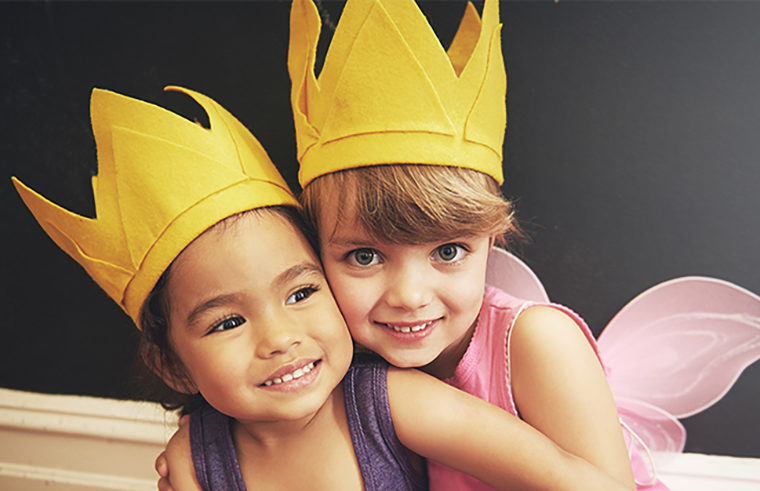 Two little girls wearing crowns