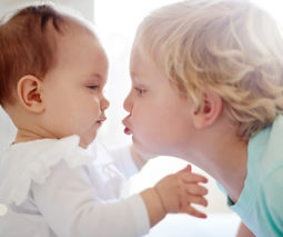 Toddler kissing baby - thumbnail