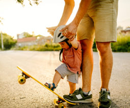Father and baby riding skateboard - feature