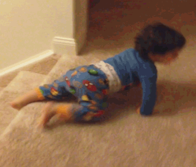 GIF baby sliding down stairs