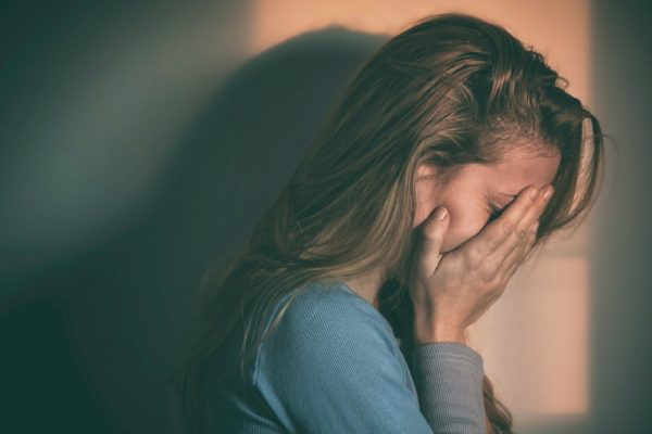 sad woman with postnatal depression
