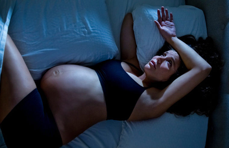 Pregnant woman awake, unable to sleep