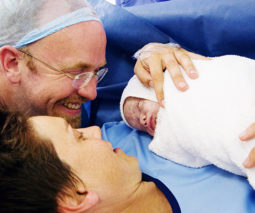 Caesarean section baby with parents - feature