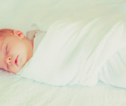 Baby asleep swaddled wrapped - feature