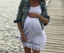Emma pregnant walking on pier - feature