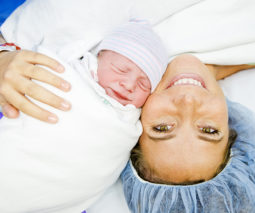 Mother and baby after caesarean birth - feature