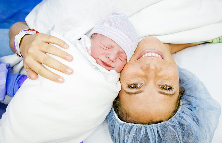 Mother and baby after caesarean birth - feature