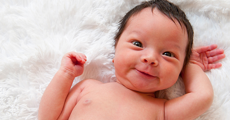 Smiling newborn baby