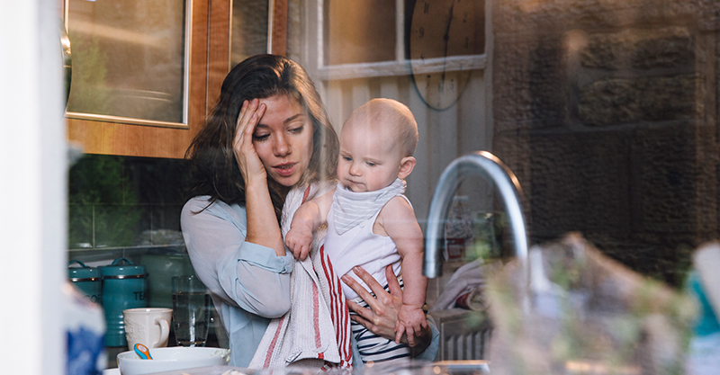 stressed mum and baby in kitchen