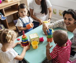 Daycare early childhood educators and kids - feature