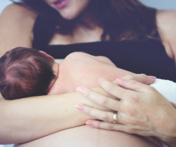 Mother breastfeeding newborn baby - feature