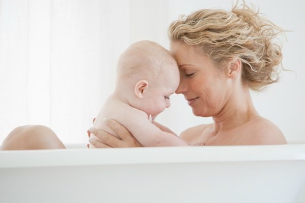 mother and baby in bath