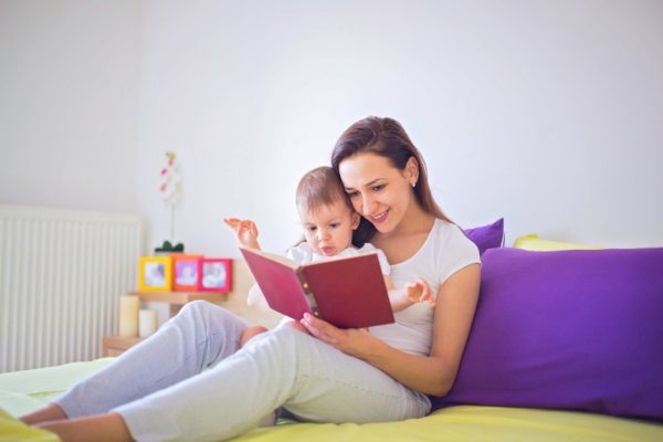 mother reading to baby