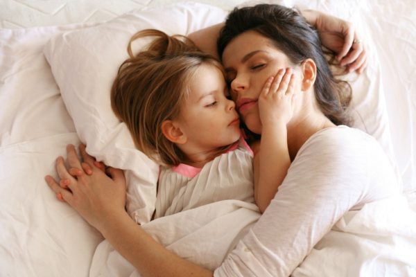 mother sleeping with daughter