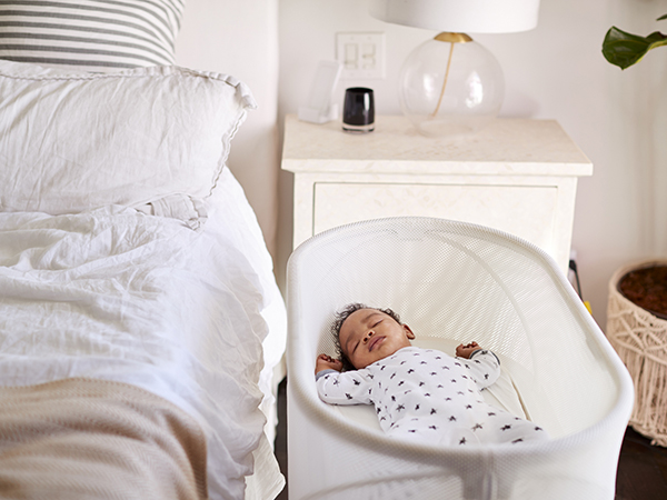 crib beside bed