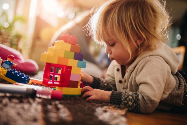 child playing with duplo