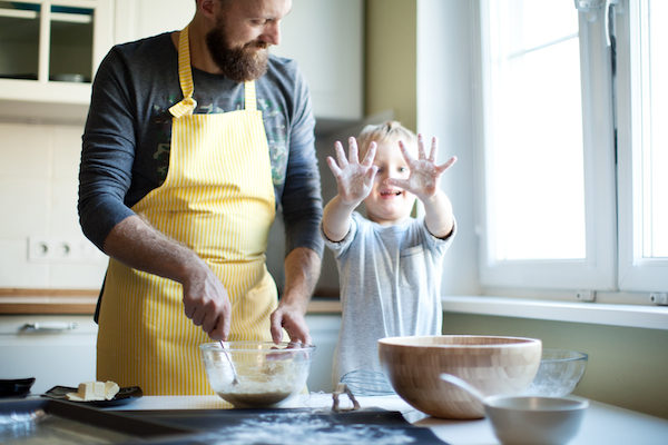 Father cooking with his son