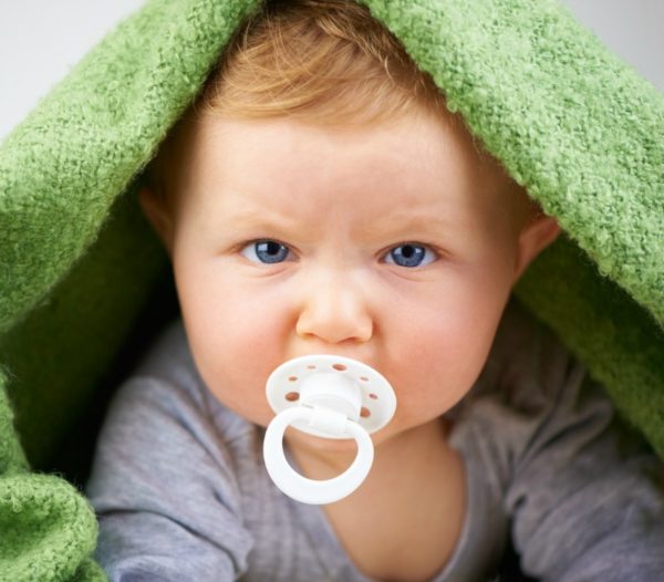 Baby with blanket over head