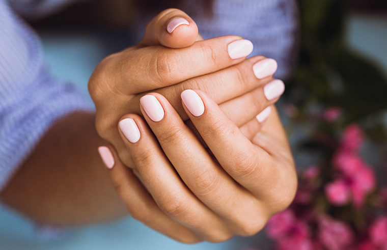 Nail polish on woman's hands feature