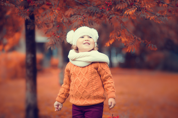 Adorable toddler girl portrait on beautiful autumn day.