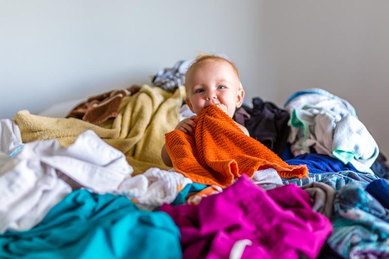 Baby in washing pile