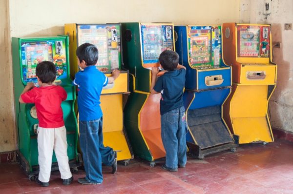 children playing arcade games