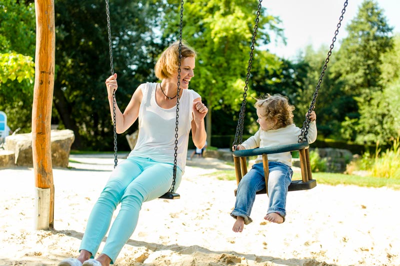 Mum and daughter on swing