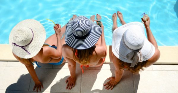 women relaxing pool