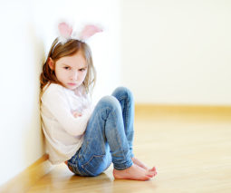 Angry naughty girl wearing bunny ears - feature