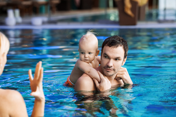 Dad and baby swimming