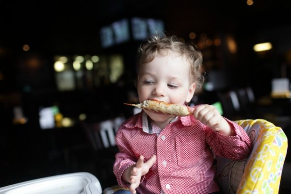 baby boy eating kebab