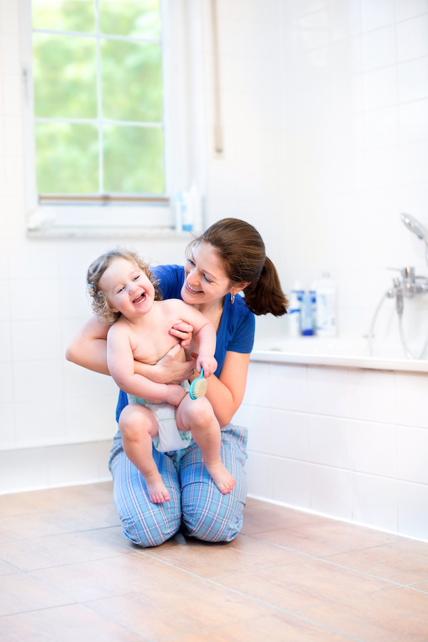 Mum in bathroom with toddler