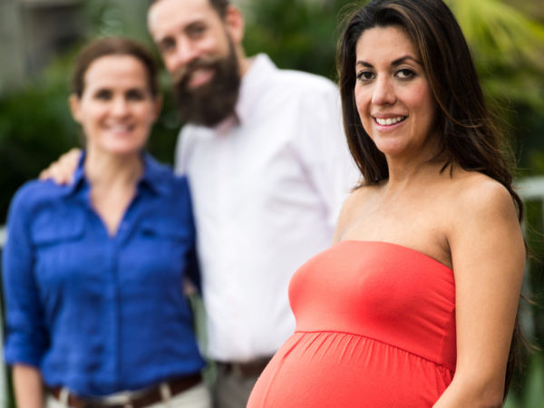 pregnant woman with couple