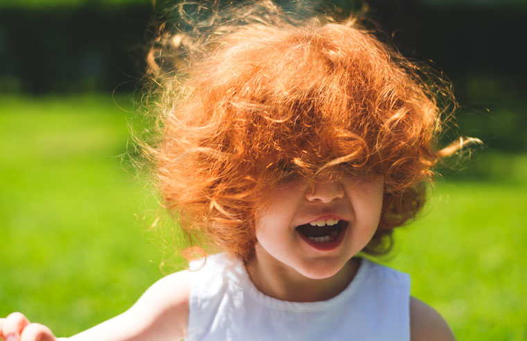 Toddler with mop of red hair