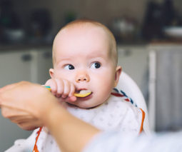 Baby eating a spoonful of food