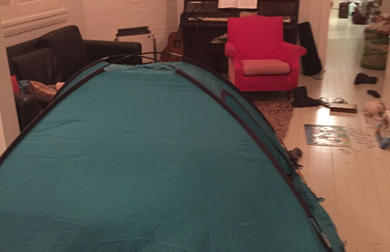 Setting a tent up in the lounge room for the kids to camp out