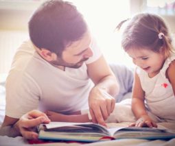dad reading with daughter