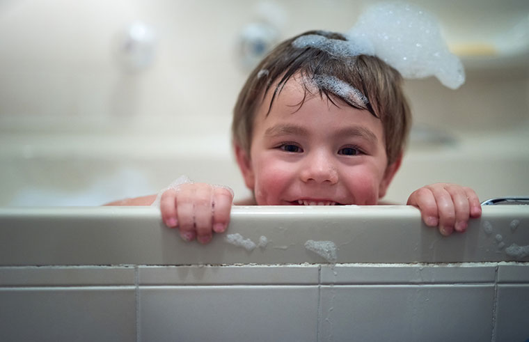 happy toddler in the bath