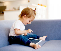 Toddler playing on the iPad