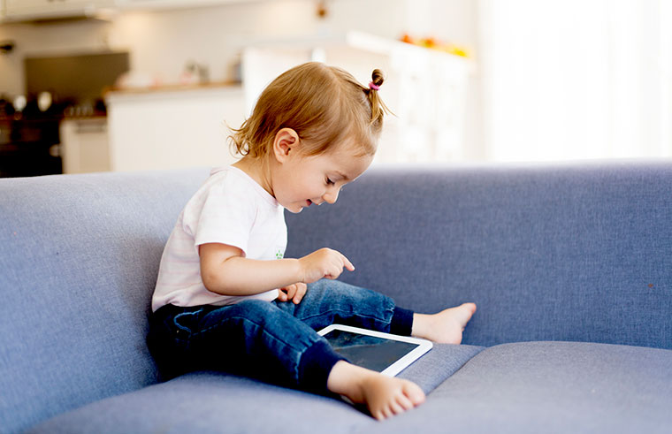 Toddler playing on the iPad