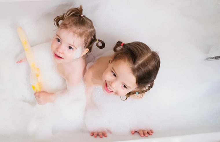 Two girls in a bubble bath - feature