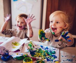 two kids finger painting